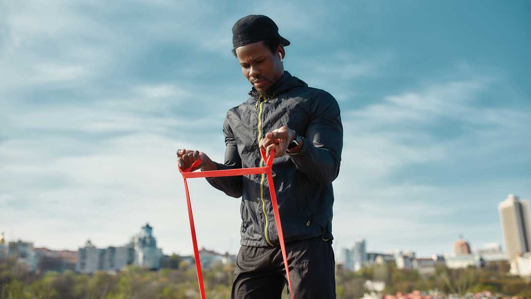 Man using resistance bands