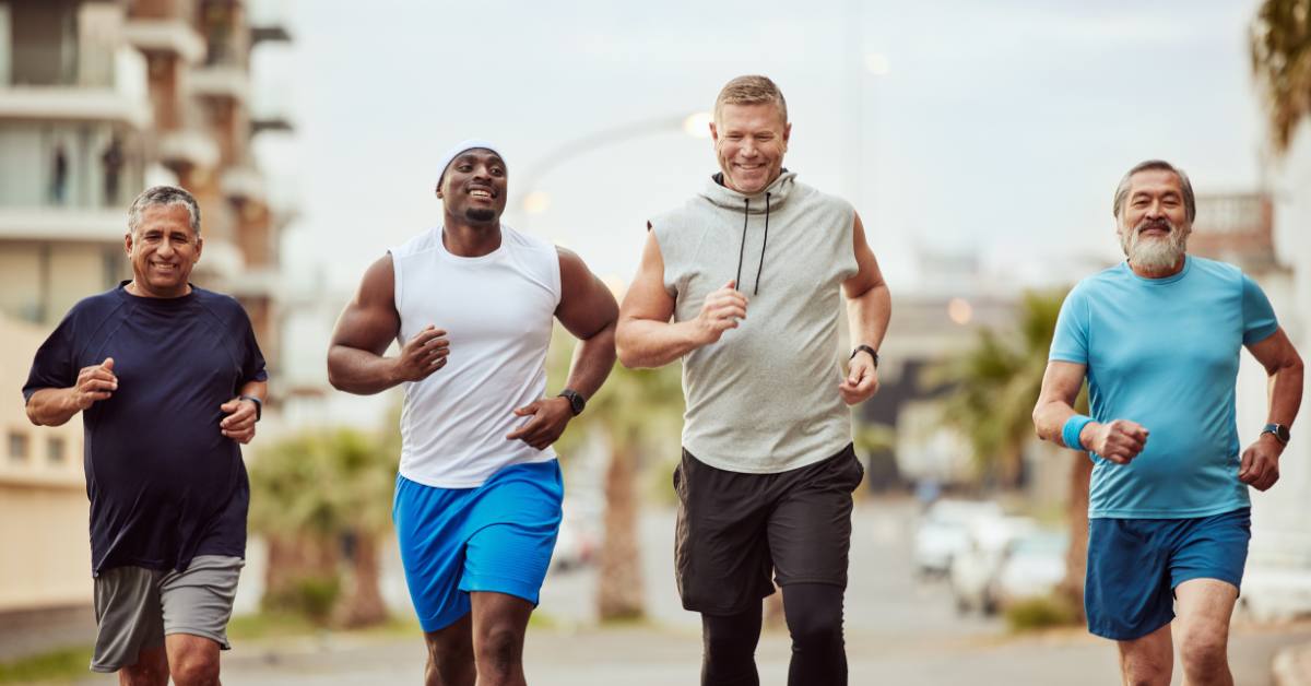 four men jogging outside
